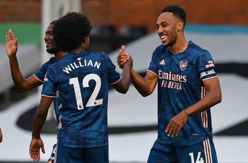 Arsenal's Gabonese striker Pierre-Emerick Aubameyang (R) celebrates scoring their third goal with Arsenal's Brazilian midfielder Willian (L) during the English Premier League football match between Fulham and Arsenal at Craven Cottage in London on September 12, 2020. (Photo by Ben STANSALL / POOL / AFP) / RESTRICTED TO EDITORIAL USE. No use with unauthorized audio, video, data, fixture lists, club/league logos or 'live' services. Online in-match use limited to 120 images. An additional 40 images may be used in extra time. No video emulation. Social media in-match use limited to 120 images. An additional 40 images may be used in extra time. No use in betting publications, games or single club/league/player publications. / (Photo by BEN STANSALL/POOL/AFP via Getty Images)