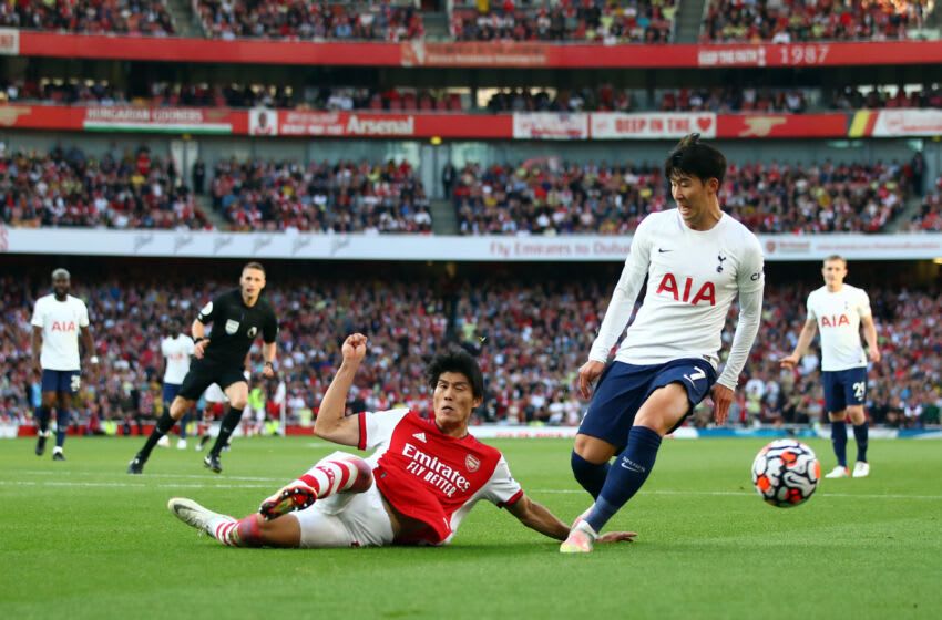 LONDON, ENGLAND - SEPTEMBER 26: Takehiro Tomiyasu of Arsenal in action with Son Heung-min of Tottenham Hotspur during the Premier League match between Arsenal and Tottenham Hotspur at Emirates Stadium on September 26, 2021 in London, England. (Photo by Marc Atkins/Getty Images)