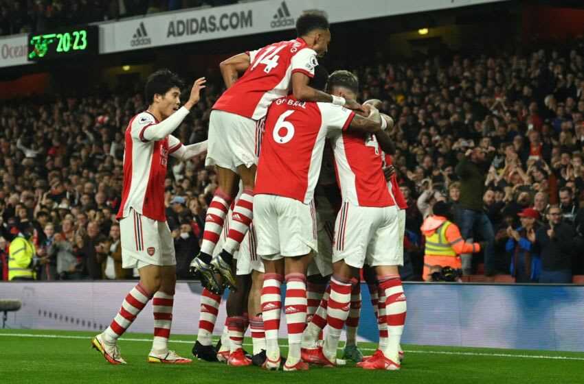 Arsenal's Ghanaian midfielder Thomas Partey celebrates with teammates after scoring his team's first goal during the English Premier League football match between Arsenal and Aston Villa at the Emirates Stadium in London on October 22, 2021. - - RESTRICTED TO EDITORIAL USE. No use with unauthorized audio, video, data, fixture lists, club/league logos or 'live' services. Online in-match use limited to 120 images. An additional 40 images may be used in extra time. No video emulation. Social media in-match use limited to 120 images. An additional 40 images may be used in extra time. No use in betting publications, games or single club/league/player publications. (Photo by Glyn KIRK / AFP) / RESTRICTED TO EDITORIAL USE. No use with unauthorized audio, video, data, fixture lists, club/league logos or 'live' services. Online in-match use limited to 120 images. An additional 40 images may be used in extra time. No video emulation. Social media in-match use limited to 120 images. An additional 40 images may be used in extra time. No use in betting publications, games or single club/league/player publications. / RESTRICTED TO EDITORIAL USE. No use with unauthorized audio, video, data, fixture lists, club/league logos or 'live' services. Online in-match use limited to 120 images. An additional 40 images may be used in extra time. No video emulation. Social media in-match use limited to 120 images. An additional 40 images may be used in extra time. No use in betting publications, games or single club/league/player publications. (Photo by GLYN KIRK/AFP via Getty Images)