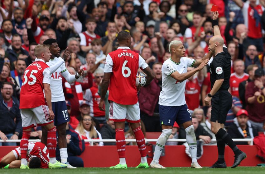 Referee anthony Taylor (R) sends off Tottenham Hotspur's Brazilian defender Emerson Royal (3L) after a foul on Arsenal's Brazilian midfielder Gabriel Martinelli (L) during the English Premier League football match between Arsenal and Tottenham Hotspur at the Emirates Stadium in London on October 1, 2022. - - RESTRICTED TO EDITORIAL USE. No use with unauthorized audio, video, data, fixture lists, club/league logos or 'live' services. Online in-match use limited to 120 images. An additional 40 images may be used in extra time. No video emulation. Social media in-match use limited to 120 images. An additional 40 images may be used in extra time. No use in betting publications, games or single club/league/player publications. (Photo by Adrian DENNIS / AFP) / RESTRICTED TO EDITORIAL USE. No use with unauthorized audio, video, data, fixture lists, club/league logos or 'live' services. Online in-match use limited to 120 images. An additional 40 images may be used in extra time. No video emulation. Social media in-match use limited to 120 images. An additional 40 images may be used in extra time. No use in betting publications, games or single club/league/player publications. / RESTRICTED TO EDITORIAL USE. No use with unauthorized audio, video, data, fixture lists, club/league logos or 'live' services. Online in-match use limited to 120 images. An additional 40 images may be used in extra time. No video emulation. Social media in-match use limited to 120 images. An additional 40 images may be used in extra time. No use in betting publications, games or single club/league/player publications. (Photo by ADRIAN DENNIS/AFP via Getty Images)