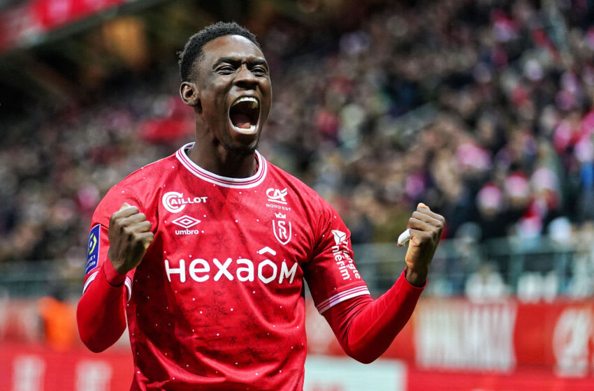 REIMS, FRANCE - DECEMBER 29: Folarin Balogun of Stade de Reims celebrates after scoring his team's 1st goal during the Ligue 1 Uber Eats match between Reims and Rennes at Stade Auguste Delaune on December 29, 2022 in Reims, France. (Photo by Sylvain Lefevre/Getty Images)