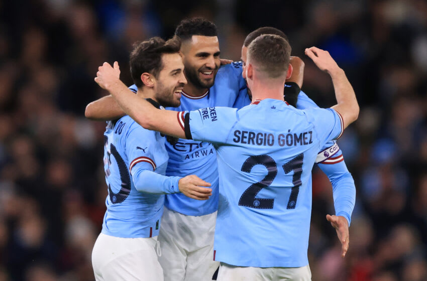 MANCHESTER, ENGLAND - JANUARY 08: Riyad Mahrez of Manchester City celebrates scoring the opening goal with Bernardo Silva and Sergio Gomez during the Emirates FA Cup Third Round match between Manchester City and Chelsea at Etihad Stadium on January 8, 2023 in Manchester, England. (Photo by Marc Atkins/Getty Images)