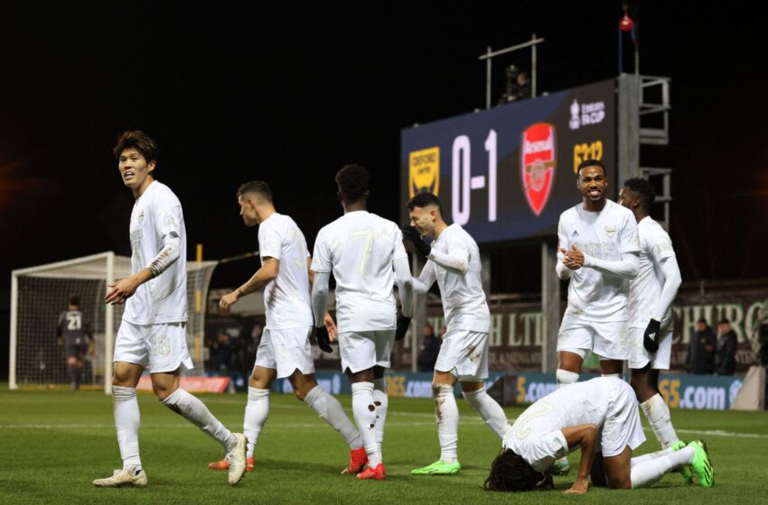 Arsenal's Egyptian midfielder Mohamed Elneny (front R) celebrates after scoring his team first goal during the FA Cup third round football match between Oxford United and Arsenal at the Kassam Stadium in Oxford, west of London, on January 9, 2023. - RESTRICTED TO EDITORIAL USE. No use with unauthorized audio, video, data, fixture lists, club/league logos or 'live' services. Online in-match use limited to 120 images. An additional 40 images may be used in extra time. No video emulation. Social media in-match use limited to 120 images. An additional 40 images may be used in extra time. No use in betting publications, games or single club/league/player publications. (Photo by ADRIAN DENNIS / AFP) / RESTRICTED TO EDITORIAL USE. No use with unauthorized audio, video, data, fixture lists, club/league logos or 'live' services. Online in-match use limited to 120 images. An additional 40 images may be used in extra time. No video emulation. Social media in-match use limited to 120 images. An additional 40 images may be used in extra time. No use in betting publications, games or single club/league/player publications. / RESTRICTED TO EDITORIAL USE. No use with unauthorized audio, video, data, fixture lists, club/league logos or 'live' services. Online in-match use limited to 120 images. An additional 40 images may be used in extra time. No video emulation. Social media in-match use limited to 120 images. An additional 40 images may be used in extra time. No use in betting publications, games or single club/league/player publications. (Photo by ADRIAN DENNIS/AFP via Getty Images)