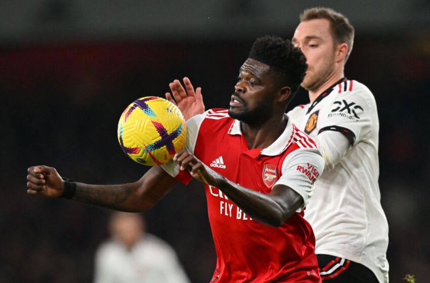 Arsenal's Ghanaian midfielder Thomas Partey (L) vies with Manchester United's Danish midfielder Christian Eriksen (R) during the English Premier League football match between Arsenal and Manchester United at the Emirates Stadium in London on January 22, 2023. - - RESTRICTED TO EDITORIAL USE. No use with unauthorized audio, video, data, fixture lists, club/league logos or 'live' services. Online in-match use limited to 120 images. An additional 40 images may be used in extra time. No video emulation. Social media in-match use limited to 120 images. An additional 40 images may be used in extra time. No use in betting publications, games or single club/league/player publications. (Photo by Glyn KIRK / AFP) / RESTRICTED TO EDITORIAL USE. No use with unauthorized audio, video, data, fixture lists, club/league logos or 'live' services. Online in-match use limited to 120 images. An additional 40 images may be used in extra time. No video emulation. Social media in-match use limited to 120 images. An additional 40 images may be used in extra time. No use in betting publications, games or single club/league/player publications. / RESTRICTED TO EDITORIAL USE. No use with unauthorized audio, video, data, fixture lists, club/league logos or 'live' services. Online in-match use limited to 120 images. An additional 40 images may be used in extra time. No video emulation. Social media in-match use limited to 120 images. An additional 40 images may be used in extra time. No use in betting publications, games or single club/league/player publications. (Photo by GLYN KIRK/AFP via Getty Images)