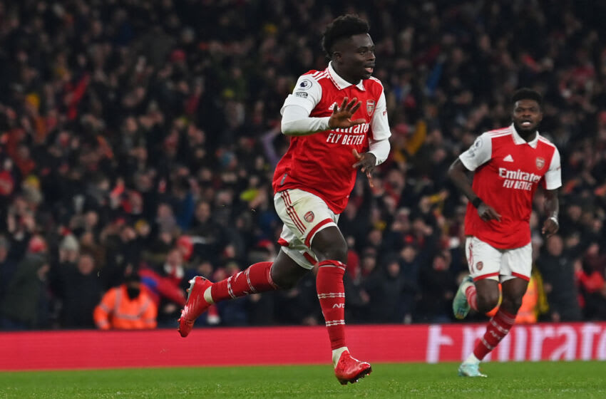 Arsenal's English midfielder Bukayo Saka celebrates after scoring their second goal during the English Premier League football match between Arsenal and Manchester United at the Emirates Stadium in London on January 22, 2023. - - RESTRICTED TO EDITORIAL USE. No use with unauthorized audio, video, data, fixture lists, club/league logos or 'live' services. Online in-match use limited to 120 images. An additional 40 images may be used in extra time. No video emulation. Social media in-match use limited to 120 images. An additional 40 images may be used in extra time. No use in betting publications, games or single club/league/player publications. (Photo by Glyn KIRK / AFP) / RESTRICTED TO EDITORIAL USE. No use with unauthorized audio, video, data, fixture lists, club/league logos or 'live' services. Online in-match use limited to 120 images. An additional 40 images may be used in extra time. No video emulation. Social media in-match use limited to 120 images. An additional 40 images may be used in extra time. No use in betting publications, games or single club/league/player publications. / RESTRICTED TO EDITORIAL USE. No use with unauthorized audio, video, data, fixture lists, club/league logos or 'live' services. Online in-match use limited to 120 images. An additional 40 images may be used in extra time. No video emulation. Social media in-match use limited to 120 images. An additional 40 images may be used in extra time. No use in betting publications, games or single club/league/player publications. (Photo by GLYN KIRK/AFP via Getty Images)