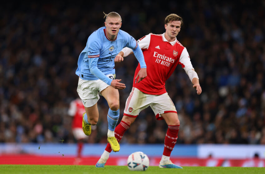 MANCHESTER, ENGLAND - JANUARY 27: Erling Haaland of Manchester City tangles with Rob Holding of Arsenal during the Emirates FA Cup Fourth Round match between Manchester City and Arsenal at Etihad Stadium on January 27, 2023 in Manchester, England. (Photo by Marc Atkins/Getty Images)