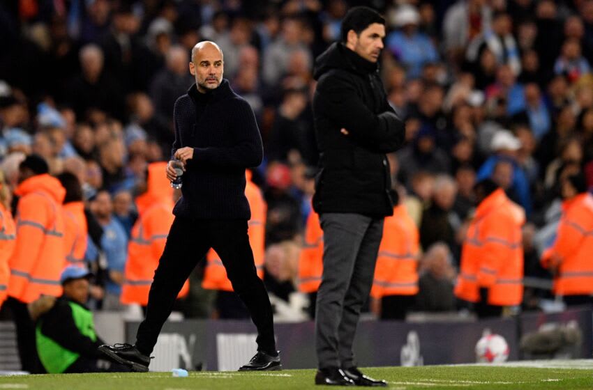 Manchester City's Spanish manager Pep Guardiola (L) and Arsenal's Spanish manager Mikel Arteta watches the players from the touchline during the English Premier League football match between Manchester City and Arsenal at the Etihad Stadium in Manchester, north west England, on April 26, 2023. (Photo by Oli SCARFF / AFP) / RESTRICTED TO EDITORIAL USE. No use with unauthorized audio, video, data, fixture lists, club/league logos or 'live' services. Online in-match use limited to 120 images. An additional 40 images may be used in extra time. No video emulation. Social media in-match use limited to 120 images. An additional 40 images may be used in extra time. No use in betting publications, games or single club/league/player publications. / (Photo by OLI SCARFF/AFP via Getty Images)