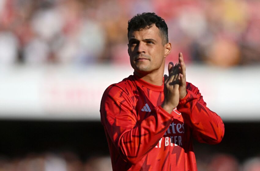 Arsenal's Swiss midfielder Granit Xhaka acknowledges supporters at the end of the English Premier League football match between Arsenal and Wolverhampton Wanderers at the Emirates Stadium in London on May 28, 2023. (Photo by Glyn KIRK / AFP) / RESTRICTED TO EDITORIAL USE. No use with unauthorized audio, video, data, fixture lists, club/league logos or 'live' services. Online in-match use limited to 120 images. An additional 40 images may be used in extra time. No video emulation. Social media in-match use limited to 120 images. An additional 40 images may be used in extra time. No use in betting publications, games or single club/league/player publications. / (Photo by GLYN KIRK/AFP via Getty Images)