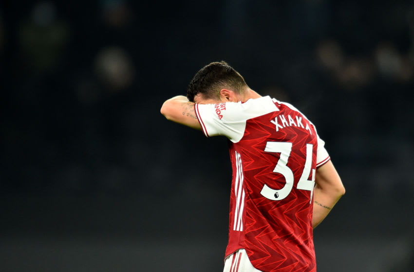 LONDON, ENGLAND - DECEMBER 06: Granit Xhaka of Arsenal looks dejected following the Premier League match between Tottenham Hotspur and Arsenal at Tottenham Hotspur Stadium on December 06, 2020 in London, England. A limited number of fans (2000) are welcomed back to stadiums to watch elite football across England. This was following easing of restrictions on spectators in tiers one and two areas only. (Photo by Glyn Kirk - Pool/Getty Images)