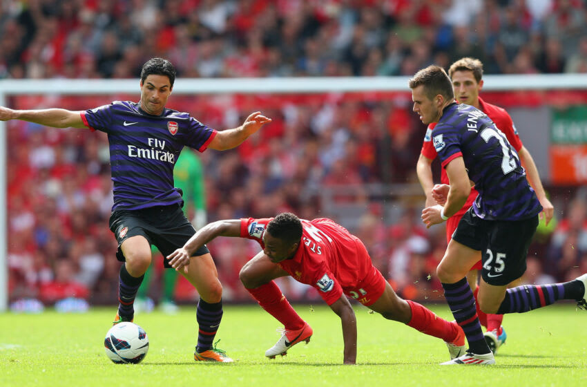 LIVERPOOL, ENGLAND - SEPTEMBER 02: Raheem Sterling of Liverpool is challenged by Mikel Arteta and Carl Jenkinson of Arsenal during the Barclays Premier League match between Liverpool and Arsenal at Anfield on September 2, 2012 in Liverpool, England. (Photo by Alex Livesey/Getty Images)