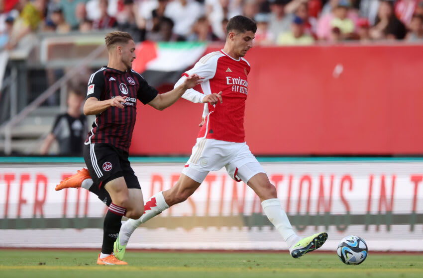 NUREMBERG, GERMANY - JULY 13: Kai Havertz of Arsenal is challenged by Lukas Schleimer of 1. FC Nürnberg during the pre-season friendly match between 1. FC Nürnberg and Arsenal FC at Max-Morlock Stadion on July 13, 2023 in Nuremberg, Germany. (Photo by Alex Grimm/Getty Images)