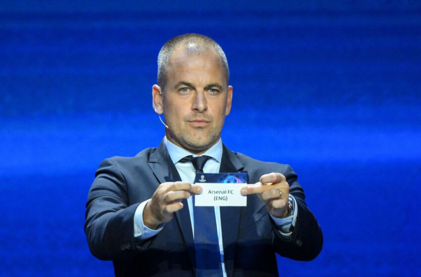 English former football player Joe Cole shows the paper slip of Arsenal FC during the draw for the 2023/2024 UEFA Champions League football tournament at The Grimaldi Forum in the Principality of Monaco, on August 31, 2023. (Photo by NICOLAS TUCAT / AFP) (Photo by NICOLAS TUCAT/AFP via Getty Images)