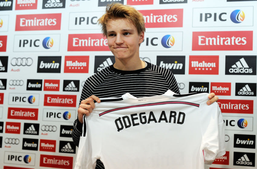 MADRID, SPAIN - JANUARY 22: Martin Odegaard from Norway holds his new Real Madrid shirt during a press conference at Real Madrid's Valdebebas training grounds after he signed with Real on January 22, 2015 in Madrid, Spain. Odegaard aged 16 will play for Real's second team Real Madrid Castilla and had been linked with many of Europe's top clubs. (Photo by Denis Doyle/Getty Images)
