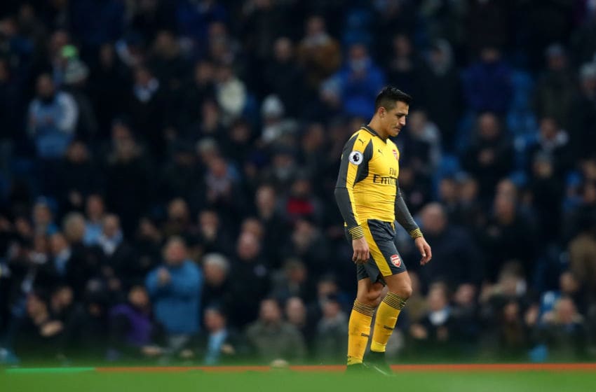 MANCHESTER, ENGLAND - DECEMBER 18: Alexis Sanchez of Arsenal is dejected after the final whistle during the Premier League match between Manchester City and Arsenal at the Etihad Stadium on December 18, 2016 in Manchester, England. (Photo by Clive Brunskill/Getty Images)