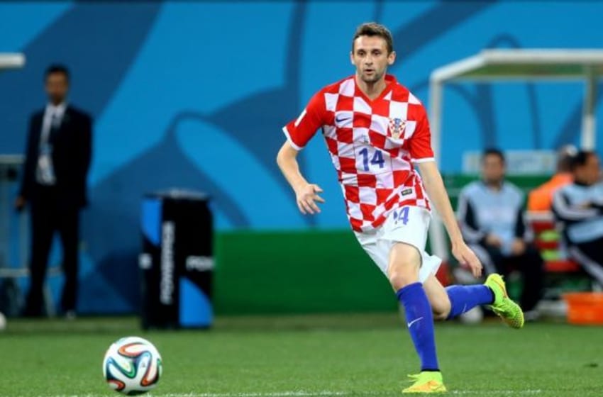 Jun 12, 2014; Sao Paulo, BRAZIL; Croatia midfielder Marcelo Brozovic (14) against Brazil in the opening game of the 2014 World Cup at Arena Corinthians. Brazil defeated Croatia 3-1. Mandatory Credit: Mark J. Rebilas-USA TODAY Sports